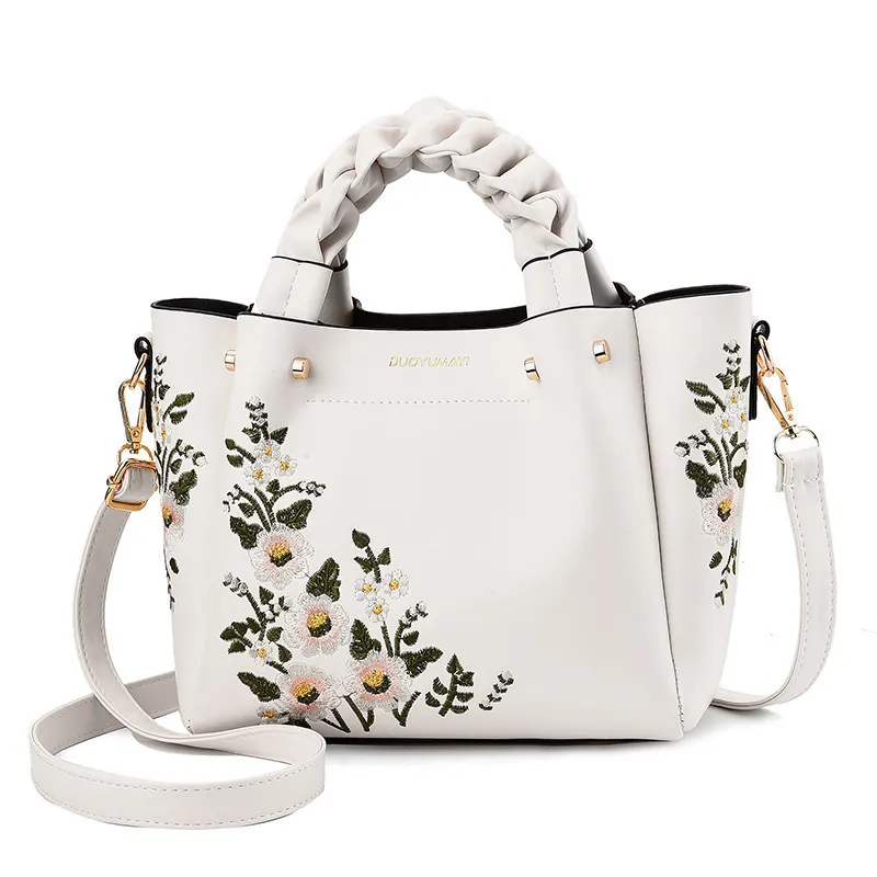 Fashionable new summer flower embroidered handbag trend one shoulder cross - slung lady handbag