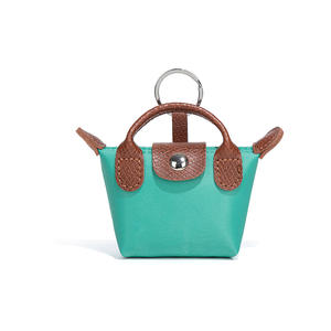 Nouveau <span class=keywords><strong>porte</strong></span>-<span class=keywords><strong>monnaie</strong></span> en forme <span class=keywords><strong>de</strong></span> boulette avec lanières <span class=keywords><strong>de</strong></span> bracelet pochette <span class=keywords><strong>porte</strong></span>-<span class=keywords><strong>monnaie</strong></span> en cuir PU avec <span class=keywords><strong>porte</strong></span>-clés Offre Spéciale pendentif MIniBag - Product Image 1