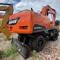 Excavatrice sur pneus d'occasion Doosan DX210, 21 tonnes, mobile, autopropulsée pour travaux d'ingénierie urbaine et de construction de pipelines