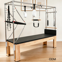 Reformers de Pilates en chêne pour la rééducation, Cadillac de Pilates avec cadre trapèze pour usage en clinique de physiothérapie