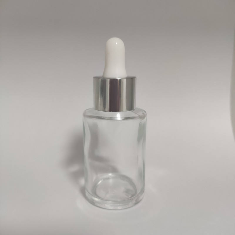 Clear bottle with silver dropper head