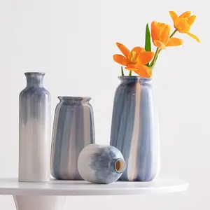 手描きの青いシンプルな円形中空素朴なモダンなセラミック花瓶ワールプールラウンドリング花瓶