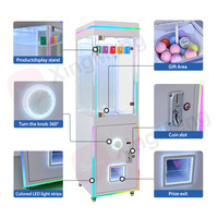 Distributeur de capsules à monnayeur pour salles d'arcade