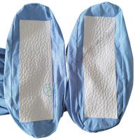 Combinaison de protection jetable non tissée ignifuge et imperméable avec capuche et bottes