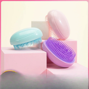 Mini cepillo portátil con forma de huevo para masaje del cuero cabelludo, peine desenredante para peluquería, peine compacto portátil de viaje - Product Image 2