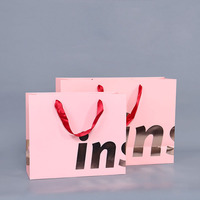 Sac en papier rose personnalisé imprimé sur mesure avec poignée en ruban pour le commerce de détail