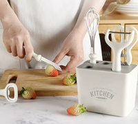 6-in-1 multifunctionele keuken gadget set met opbergbak, schaar, schilmesje, messen, eiermixer en flesopener voor thuisgebruik