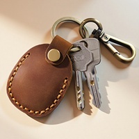 Porte-clés portable personnalisé avec pochette à monnaie en cuir véritable à la mode Tracker Cover Car Hanging Mini Storage Keychain