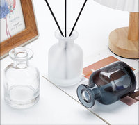 Vente en gros de bouteille de diffuseur vide ronde noire de luxe de 100ml 200ml avec bâton et boîte pour diffuseur d'huile aromatique