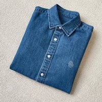 Chemise en jean bleue de style rétro pour femmes, broderie artisanale sur la poitrine, chemise en jean en coton tendance pour l'automne et le printemps