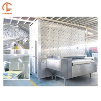 Grand congélateur tunnel automatique industriel en acier inoxydable avec moteur pour légumes, viandes et fruits de mer surgelés, haute productivité