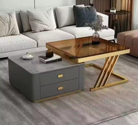 Table basse moderne de luxe avec plateau relevable en pierre frittée, tiroir de rangement et structure en métal noir pour salon