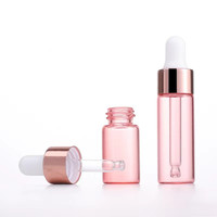 Bouteille de compte-gouttes de sérum Rose à huile ronde en verre 1ml 2ml 3ml 5ml bouteille de compte-gouttes oculaire en or Rose bouteille de compte-gouttes Rose pour les cosmétiques