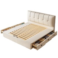 Lit capitonné en cuir véritable blanc crème moderne de luxe avec tiroirs de rangement à vérins hydrauliques et tête de lit capitonnée, taille King