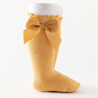 Vente en gros Chaussettes longueur genou pour petites filles Couleur pure Automne Printemps Étudiants Enfants Robe en coton Chaussettes tubulaires Collants