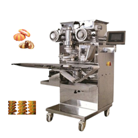 Machine de remplissage de pâte commerciale pour l'égyptien Aish Baladi avec fabricant de desserts farcis au pain sucré aux dattes