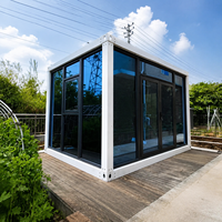 Bâtiment modulaire préfabriqué à assemblage rapide avec façade transparente, utilisable comme bureau, salle de réunion portable, salle d'exposition mobile, studio ou pièce de réception