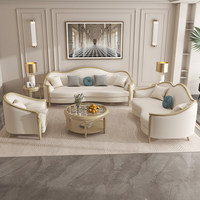Cremefarbenes Minimalistisches Europäisches Luxus-Ledersofa-Set Massivholz Goldene Verzierung Geschwungenes Sofa-Stuhl-Set für Wohnzimmer