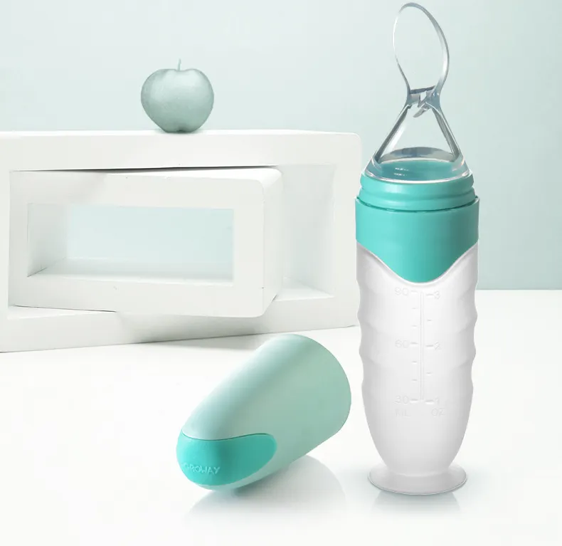 Alimentador de cuchara de silicona sin BPA para bebé, botella de alimentación con cuchara, alimentador de botellas para niños, venta al por mayor