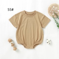 Prêt à expédier 100% coton bio été nouveau-né infantile enfant en bas âge sexe neutre solide coton à manches courtes bébé body barboteuse