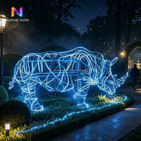 Sculpture lumineuse en forme de rhinocéros en fer, changeant de couleur en 3D, NUOWEI GLOW, pour les parcs à thème en plein air, les zoos, les décorations de Noël et les décorations scéniques