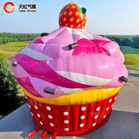 Château gonflable géant commercial en forme de cupcake à la fraise