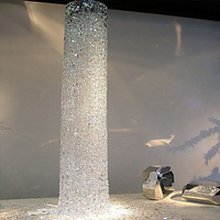 Lustre en cristal en cascade à colonnes rondes, luminaire suspendu vertical personnalisé pour hall d'hôtel, villa, plafond haut, escalier