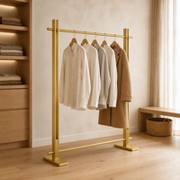 Porte-vêtements simple en acier inoxydable doré brossé, avec barre de base stabilisatrice et joints soudés sans couture, OEM ODM, pour boutiques de vêtements sur mesure