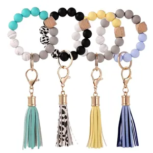 Porte-clés en Silicone pour clés, pompon, perles en bois, Bracelet, porte-clés pour femmes, perles multicolores, porte-clés de mode, vente en gros