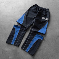 Conjunto Deportivo de 2 Piezas con Pantalones Desmontables, Chaqueta Cortavientos de Nailon Ligero y Transpirable con Diseño de Parches para Hombre