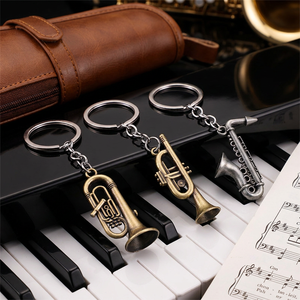 Mini saxophone porte-clés en bronze antique, cadeau de remerciement pour professeur de musique, instrument miniature, pendentif de sac pour étudiants - Product Image 1
