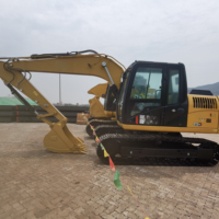 Excavatrice hydraulique sur chenilles 12 tonnes 312GC 0,53 m³ avec coupleur rapide, marteau brise-roche, grappin et tarière