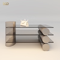 Table de présentation cylindrique en verre fumé avec étagère superposée, colonne pour accessoires de sacs à main, aménagement de boutique de luxe sur mesure OEM