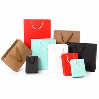 Sacs en papier personnalisés de luxe avec impression couleur, fabriqués à partir de matériaux recyclés, finition mate, avec poignée, pour l'emballage de bougies en boutique