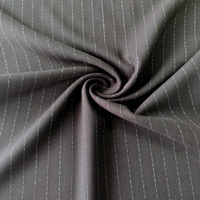 Tissu uni teint unique, extensible, noir, 330 g/m², 63 % polyester, 33 % viscose, 4 % élasthanne, pour costumes et vêtements pour garçons