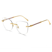 Lunettes de vue photochromiques anti-lumière bleue WENDUO œil de chat, monture sans bords en métal doré, verres à bords taillés en diamant pour femmes