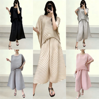 Ensemble deux pièces asymétrique plissé diagonalement, tunique à manches longues avec fente latérale et jupe longue portefeuille, tenue modeste pour femme, automne, vente en gros, OEM