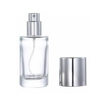 Bouteille de parfum en verre transparente cylindrique de 20ml mini capacité portionnement bouteille de parfum en verre vide avec pulvérisateur à pompe vente en gros