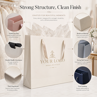 Sac de robe de mariée en carton ivoire avec poignée en ruban de satin de luxe et autocollants en papier de soie personnalisés pour boutique de mariée