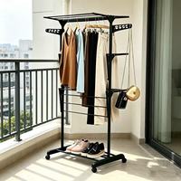 Séchoir à linge pliable et mobile en métal noir pour rangement de vêtements