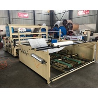 Machine automatique de découpe et de rembobinage de papier en maxi-rouleaux et en petites bobines