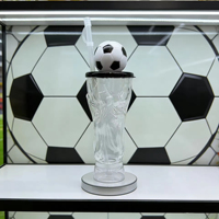 Nouveau produit en stock : Bouteille d'eau en plastique en forme de trophée, gobelet à bière en PET en forme de ballon de football pour le Tournoi Mondial de Football 2026