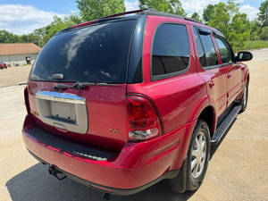 Véhicule d'occasion pas cher Rainier AWD CXL Plus SUV 4 portes 2004 avec régulateur de température, radio, On-Star, sièges en cuir gauche, phares à LED - Product Image 5