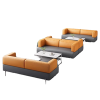 Ensemble de canapés sectionnels en cuir synthétique au design moderne, table basse pour les négociations commerciales, le repos du personnel de bureau, le salon