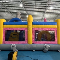 Château gonflable combiné avec toboggan sur le thème de l'aventure spatiale, astronaute, extraterrestre, fusée, pour les fêtes d'enfants