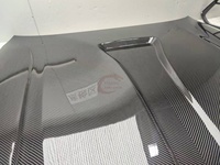 Capot en fibre de carbone sèche de style PK de haute qualité pour BMW M3 M4 G80 G82 Capot en fibre de carbone sèche