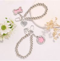 Nouveau design porte-clés mousqueton en alliage de zinc avec pendentif étoile à cinq branches incrusté de diamants, accessoire léger pour téléphone portable iPhone