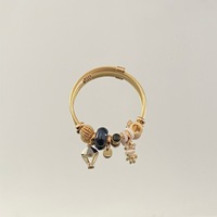 Panjiadola Bracelet en acier inoxydable de style nouveau pour femme, avec pendentif en alliage incrusté de diamants en forme de petit lapin monté sur montgolfière