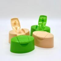 Emballage cosmétique pour soins quotidiens, bouchon à clapet brillant en PP couleur personnalisée, accessoire de couvercle de bouteille en plastique à clipser