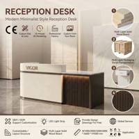 Bureau d'accueil haut de gamme finition noyer avec logo rétroéclairé par bande LED, aménagement personnalisable pour studio de design, boutique, salon, hôtel, bureau